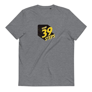 May include: A heather grey t-shirt with a black and yellow logo that says "The 39 Steps".