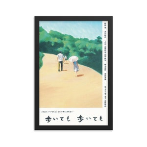 May include: A painting of three people walking on a path through a forest. The path is winding and the trees are green. The painting is in a black frame. The text in the image reads: "Life is always a little bit behind." "Walking and walking."