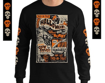 May include: Black long-sleeve t-shirt with an orange and black Halloween-themed graphic featuring a monster, a mermaid, and a skull. The graphic includes the text "Trick-or-Treat", "Halloween", "Feejee Mermaid", "Mommy", "Glow Skull", "Slashed", and "Your Last Trick-or-Treat".