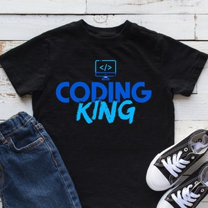 May include: Black t-shirt with blue text that reads "Coding King" and a small image of a computer monitor with code symbols on the screen.