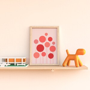 May include: A wooden shelf with a white and orange model house, a framed print of pink and red circles, and an orange plastic dog figurine.
