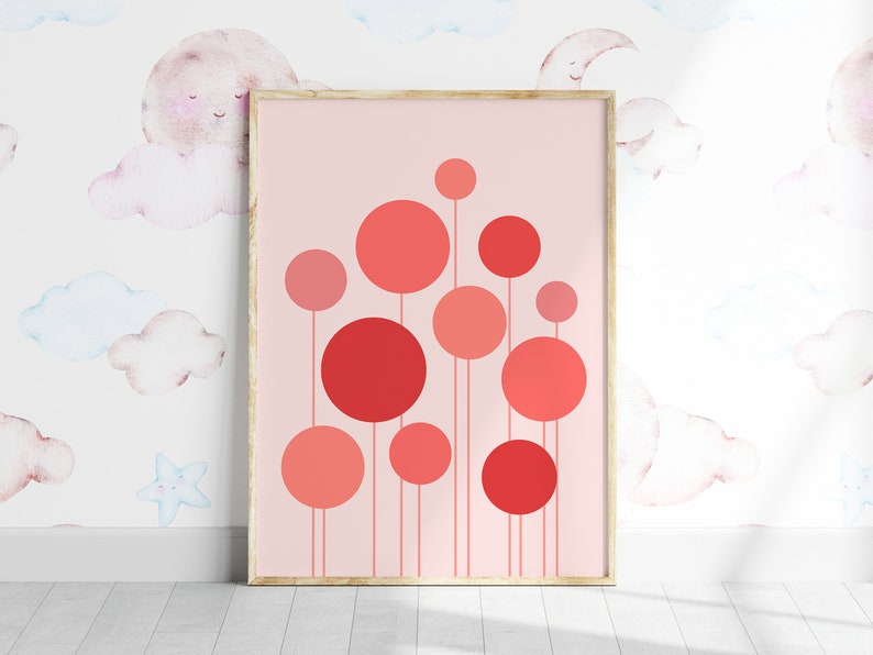 May include: A framed print with a pink background and a design of red and pink circles on stems. The circles are arranged in a cluster, with the largest circle at the top.