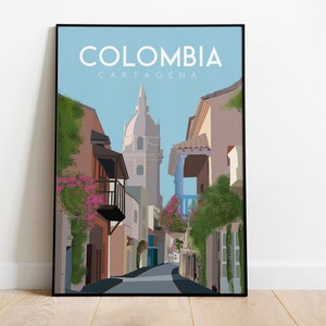 May include: A colorful illustration of a street scene in Cartagena, Colombia. The image features a narrow street lined with colorful buildings, lush greenery, and a tall church tower in the background. The text "COLOMBIA CARTAGENA" is displayed at the top of the image.