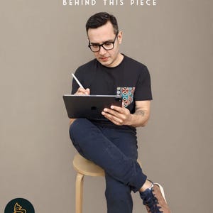 May include: A person wearing glasses and a black t-shirt with a colorful pocket design, holding a tablet and stylus. The text "MEET THE ARTIST BEHIND THIS PIECE" is at the top. The Arctic Frame Studio logo is at the bottom.