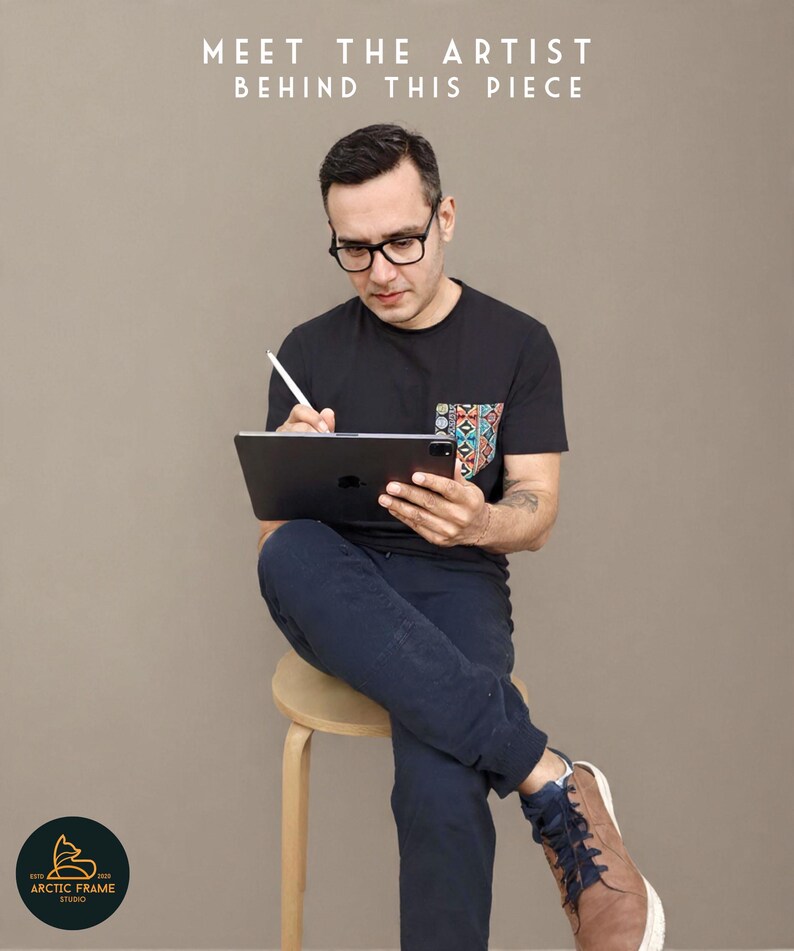 May include: A person wearing glasses and a black t-shirt with a colorful pocket design, holding a tablet and stylus. The text "MEET THE ARTIST BEHIND THIS PIECE" is at the top. The Arctic Frame Studio logo is at the bottom.