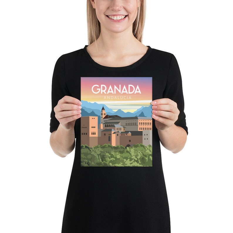 May include: A poster featuring a stylized illustration of Granada, Andalusia. The artwork depicts the city's architecture in shades of brown and tan, with a backdrop of mountains and a gradient sky. The text "GRANADA ANDALUCIA" is displayed at the top.