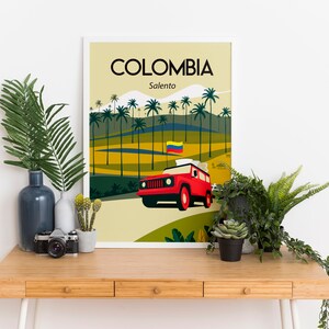 May include: A framed art print featuring a stylized landscape of Colombia's Salento region. The print showcases a red vehicle, palm trees, and the Colombian flag. The word "COLOMBIA" is at the top.