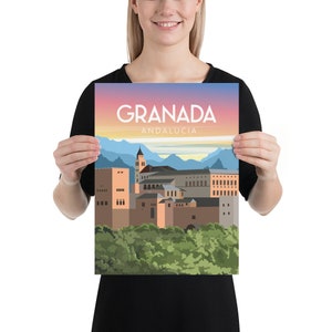 May include: A poster featuring a stylized illustration of Granada, Spain, with the city's name and "Andalucia" in white text against a sunset sky. The artwork depicts buildings, a tower, and mountains.