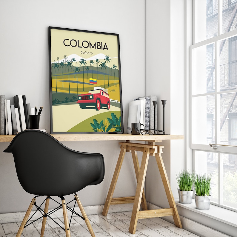 May include: Framed art print featuring a stylized illustration of Colombia's Salento region. The artwork depicts a red jeep driving on a road, with palm trees and mountains in the background. The print has the word "COLOMBIA" at the top.