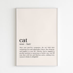 Peut inclure: Une impression murale imprimable avec un fond blanc et du texte noir. Le texte dit "cat noun - /kæt/ Meet your purr-fect companion, the cat! With their enchanting eyes and independent charm, they bring joy and laughter to your life. Whether they're napping in peculiar positions or pouncing on feather toys, cats fill your days with love and hilarious antics, making every moment whisker-ly delightful!"