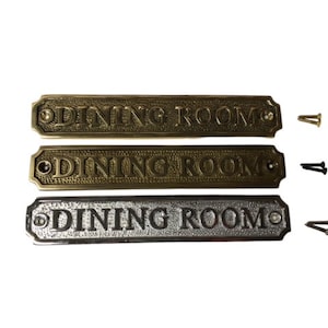Dining room brass door sign