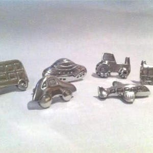Drawer handles pulls for Children's furniture, Transport designs train, car, plane, tractor, spaceship and bus . Six piece set with screws.