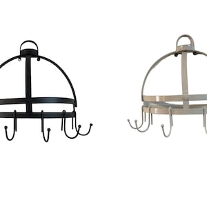 May include: A black and a silver pot rack with 12 hooks each. The racks are made of metal and have a dome shape. They are hanging from the ceiling.