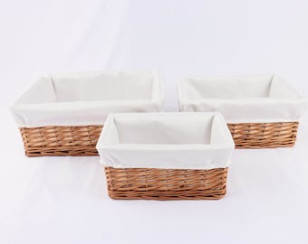 Set of 3 natural buff rectangular hampers, small, medium & large. Wicker baskets.