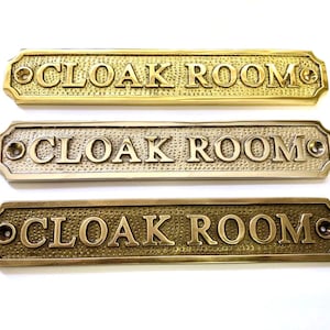 Cloak room solid brass door sign available in a choice if three finishes antique bronze, nickel or polished brass. Matching screws provided.