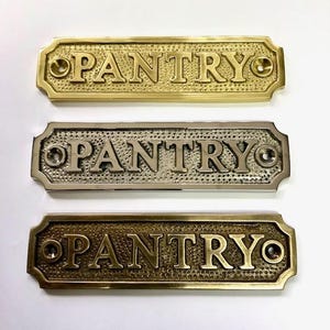 Pantry solid brass door sign plaque available in three finishes nickel, antique bronze or polished brass. Matching screws provided.