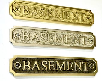 Basement door sign made from solid brass choose finish. Brass, nickel or antique bronze. The plaque is sent with screws. 16.5 x3.2x0.4 CM
