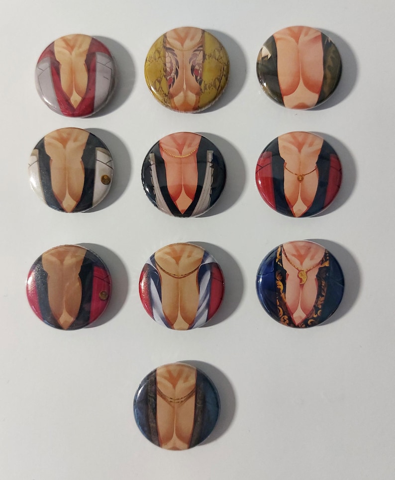 May include: Ten round button pins featuring a stylized image of a person's torso with different clothing and jewelry designs. The designs include a red jacket, a yellow patterned shirt, a blue shirt with a white collar, and a gold chain necklace.