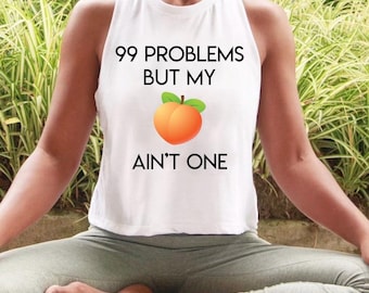 Canotta corta da allenamento da donna "99 Problems But My Peach Ain't One"