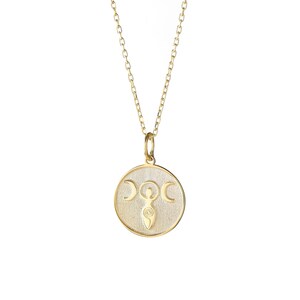 May include: A gold necklace with a round pendant featuring a stylized image of a woman with three crescent moons above her head.