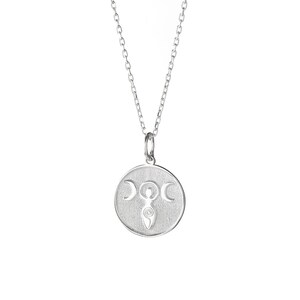 May include: Silver necklace with a round pendant featuring a triple moon goddess symbol.