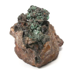 May include: A raw mineral specimen featuring a base of textured, earthy brown rock. The upper portion displays a cluster of dark, metallic-looking formations interspersed with vibrant, powdery mint-green mineral deposits across the jagged surface.