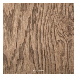 May include: Close-up of a wood grain texture with a brown and gray color scheme. The wood has a natural, aged look and is labeled "Aged Barrel".