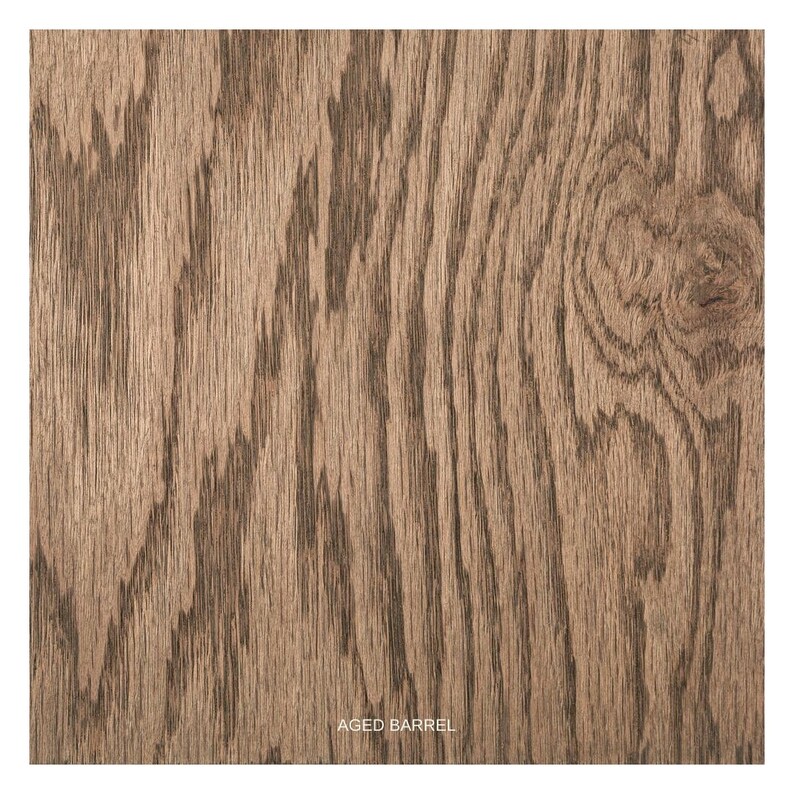 May include: Close-up of a wood grain texture with a brown and gray color scheme. The wood has a natural, aged look and is labeled "Aged Barrel".