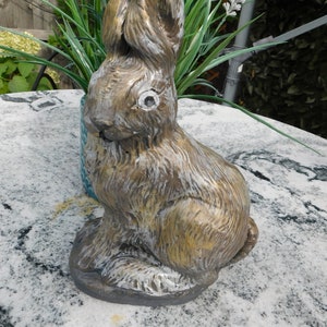 A Hand cast stone statue of a Hare Sitting