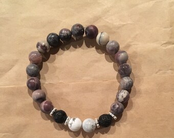 Purple beaded bracelet with lava and marble accent beads