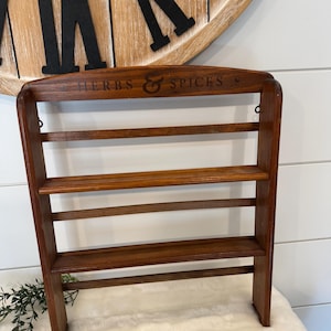 May include: A set of three ceramic mugs with a speckled, matte finish. The mugs are in shades of cream, light gray, and dark gray. Each mug has a simple, minimalist design, perfect for coffee or tea.