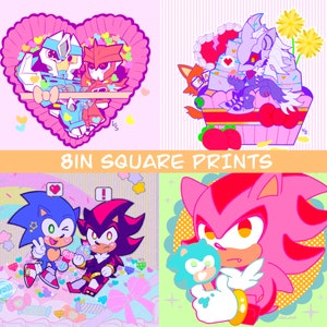 Puede incluir: Cuatro coloridas impresiones cuadradas de 20,3 cm con personajes de dibujos animados. Una impresión muestra dos robots en un corazón rosa. Otra muestra personajes en una magdalena. La tercera muestra dos personajes con caramelos. La última muestra un personaje con una piruleta.