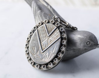 Antique English Victorian Silver Aesthetic Era Bird Locket with Bird and Stars with Swivel Dog Clasp