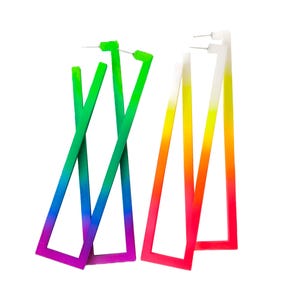 May include: Two pairs of geometric earrings. One pair is a gradient of green, blue, and purple. The other pair is a gradient of yellow, orange, and pink. Both pairs have a triangular shape and are set against a white background.