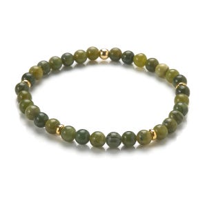 May include: A green jade stone beaded bracelet with gold accents. The bracelet is made of round beads and has a simple design.