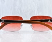 Cartier rimless Buffs Chocolate Buffalo Horn C decor Platinum sunglasses Strawberry lens Artifact