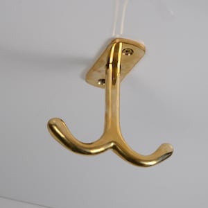 Dubbelkrok i olackerad mässing för taket