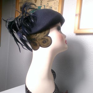 Vintage M. HOWARD FEATHERED HAT – Dark Blue 100% Wool Cap Accented with Plume of Blue & Black Feathers, Small Gold Bead Accents - Size 23&quot;