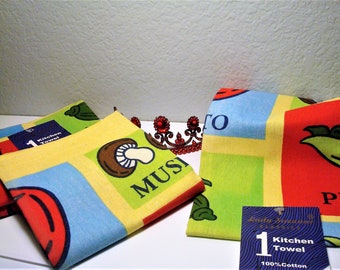 May include: Set of three colorful kitchen towels with a variety of designs, including mushrooms, peppers, and leaves. The towels are made of 100% cotton and feature the text "1 Kitchen Towel" and "Lady Strawberry Classics".
