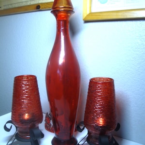 Vintage RED GLASS DECOR (3 Pieces) - Tinted Red Glass 18.5&quot; Bottle, Cork Stopper - Pair Wrought Iron, Tinted Ribbed Red Glass Candleholders