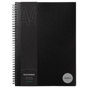 May include: A black A4 dot grid notebook with a black spiral binding. The cover has a subtle dot pattern and the text "Dot Grid Notebook" and "www.dotgrid.co" printed on it. The notebook has 160 dot grid pages and 120 gsm black paper.