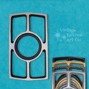 May include: A silver metal frame with a black center ring and four black rectangular openings. The frame is on a blue background. Vintage Revival Art Co. is printed in white text on the background.