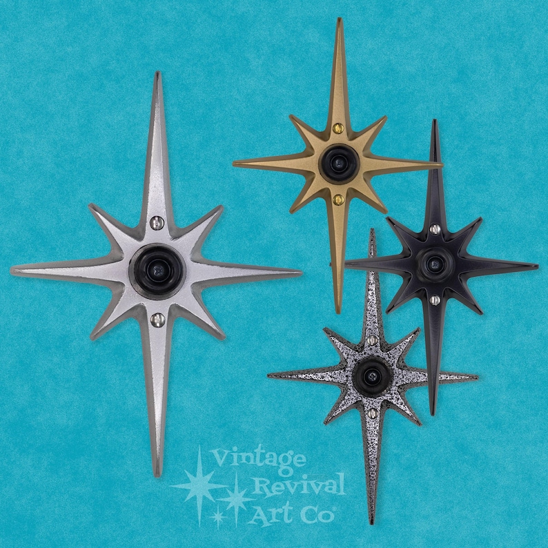 May include: Four starburst-shaped doorbells in different finishes: silver, gold, black, and a textured silver. The doorbells are all the same size and shape, with a central button and a starburst design.