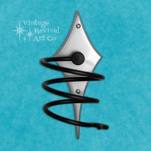 May include: A decorative wall-mounted wine rack. The rack features a silver diamond-shaped backplate with a black spiral wine holder. The text "Vintage Revival Art Co" is visible in the upper left corner. The rack is mounted on a turquoise background.