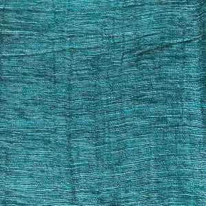May include: A close-up of a teal blue woven fabric with a textured surface.