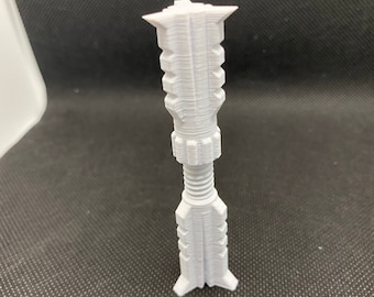 May include: A white plastic 3D printed model of a tower with a textured surface.