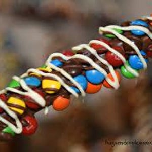 Chocolate and M & M cover pretzels rods.