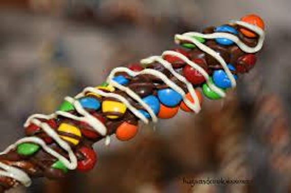 Chocolate and M & M cover pretzels rods.