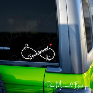 May include: White vinyl decal of an infinity symbol with the word "Loveeternal" written inside. A small red heart is placed above the infinity symbol.