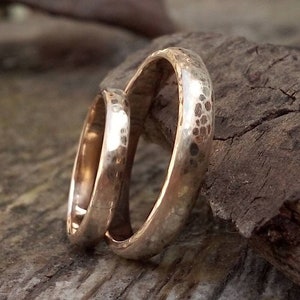 Handcrafted hammered gold wedding rings